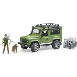 Land Rover Defender Station Wagon mit Förster und Hund
